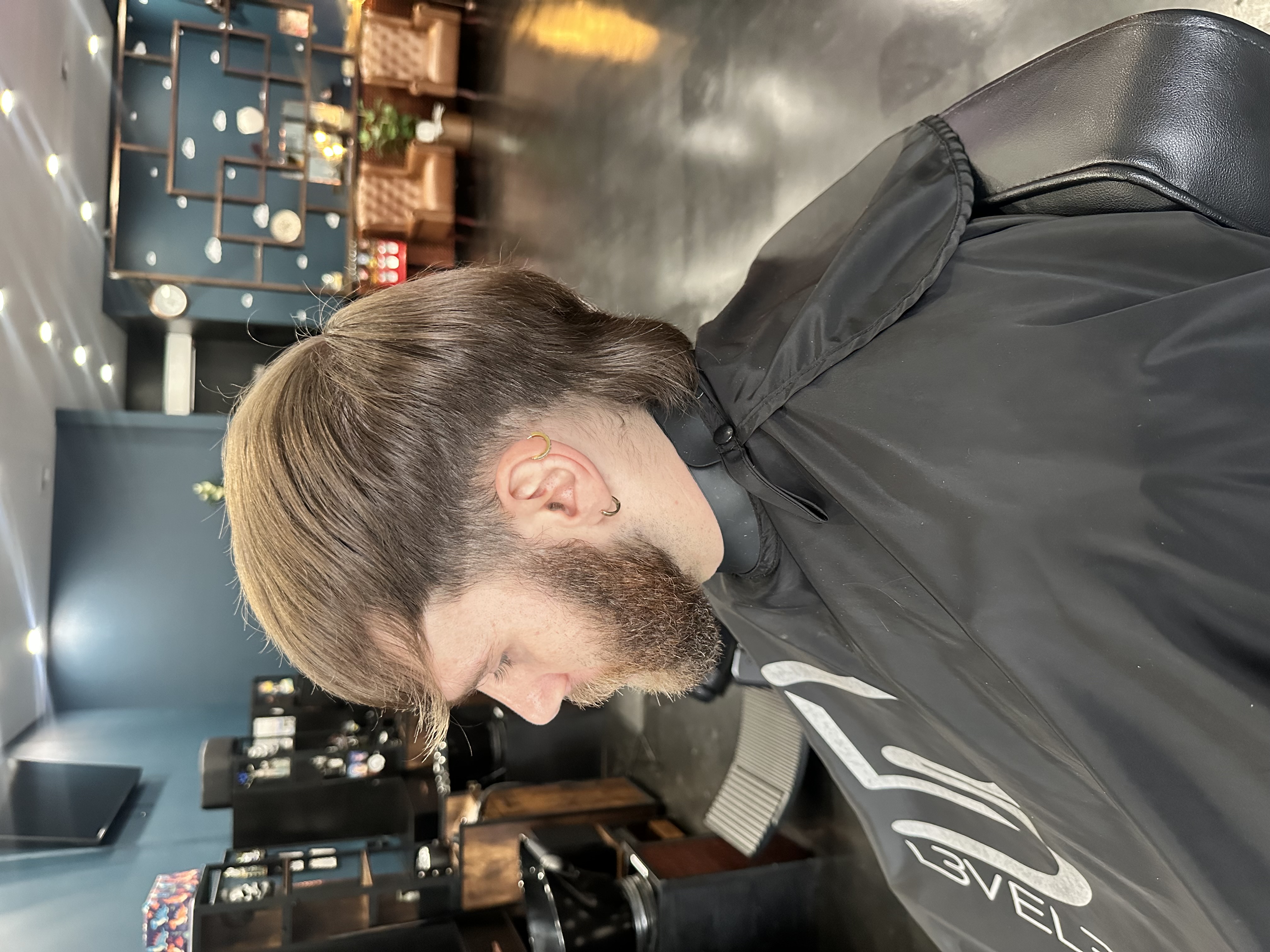 Before: client before a haircut at Steel and Stubble